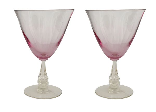 A charming pair of pink martini glasses with clear stems. These glasses combine timeless style with 