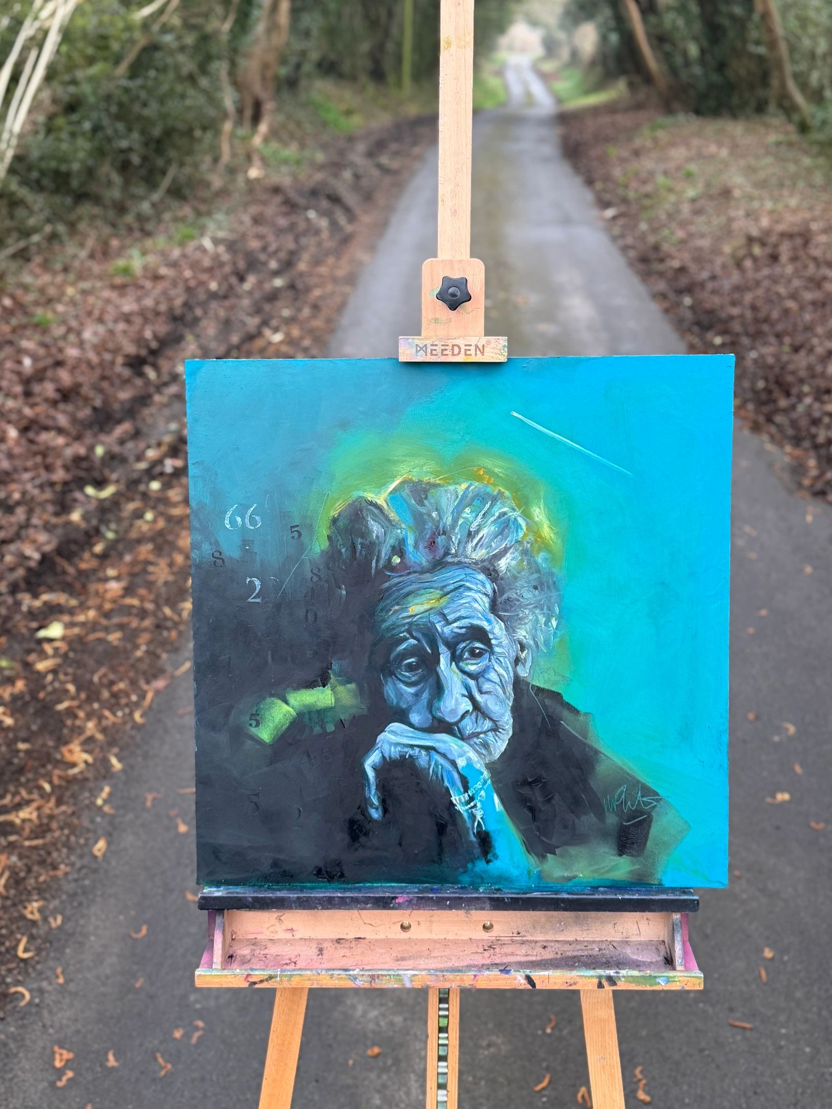 Old lady contemplating where her life went. Painting on Easel on a country road.