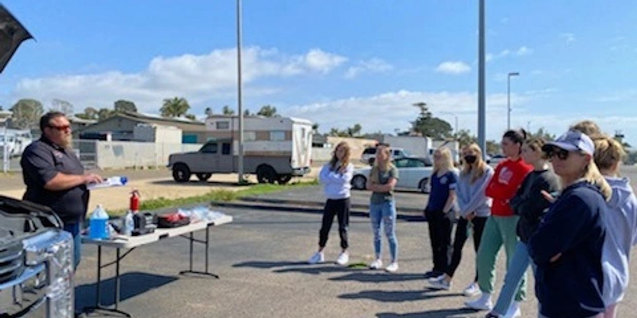 Owner Brad Dow talking to a group of people