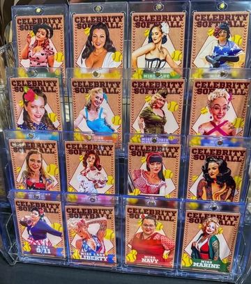 Display of Celebrity Softball trading cards in a rack.