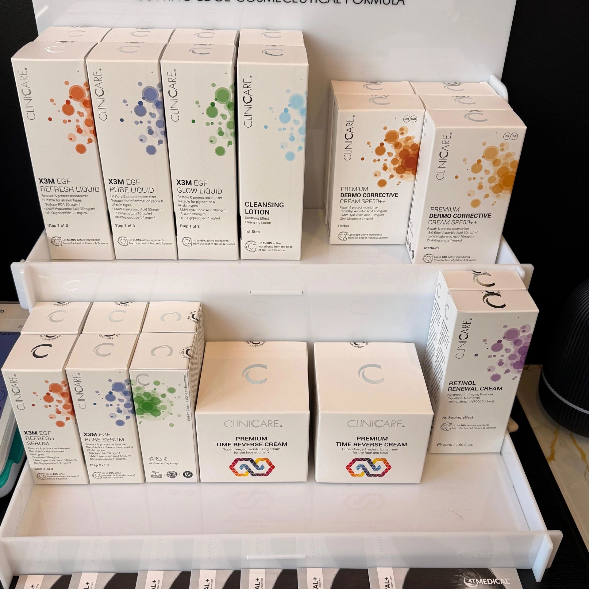 Display of Clinicare skincare products with various creams and serums.