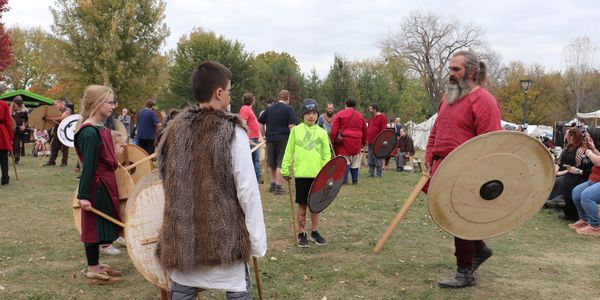 Kids participating in a Viking combat training activity the Great Northern Viking Festival.