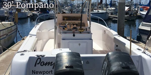 Pompano center console boat in boat slip at Dana Landing