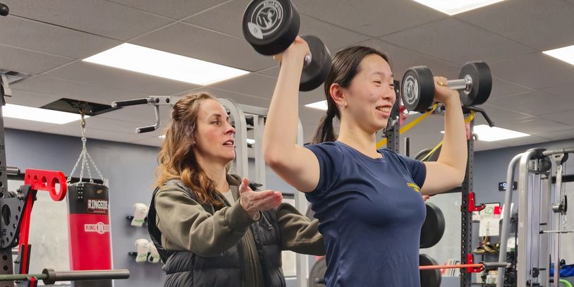 Trainer coaching a client during a private personal training session at LiV in St. Catharines