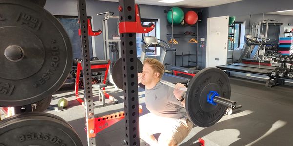 Client performing a strength exercise in LiV’s private training studio