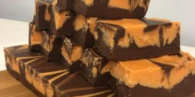 Stack of chocolate and peanut butter fudge squares.