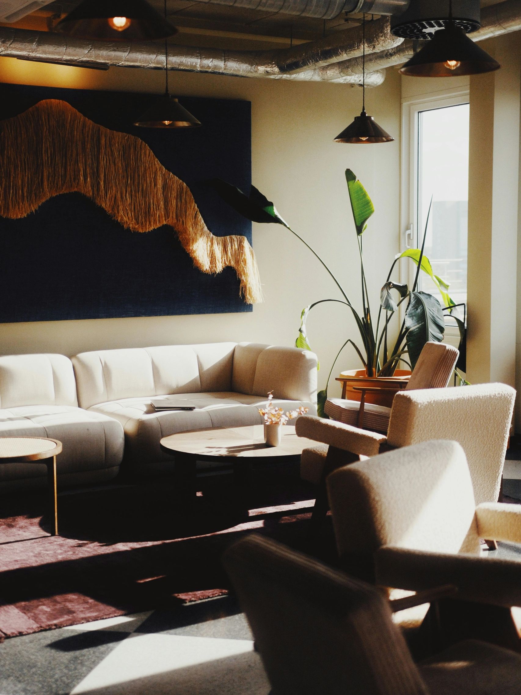 Cozy living room with natural light and modern decor.