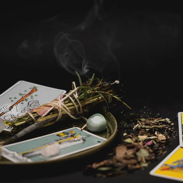 Incense and tarot cards on display.