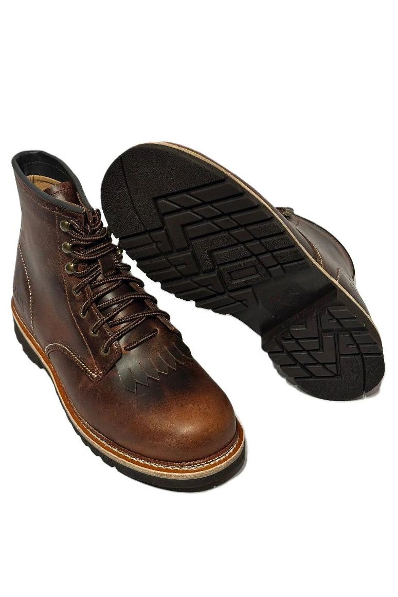 Pair of brown leather boots with rugged soles and detailed stitching.