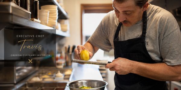 Executive chef Travis zesting a lemon in a professional kitchen.