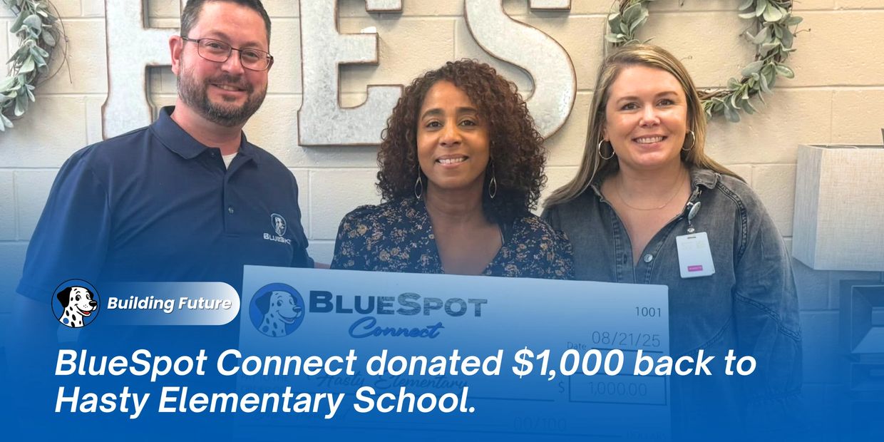 BlueSpot Connect representative presents a $1,000 donation check to the recipient Hasty Elementary