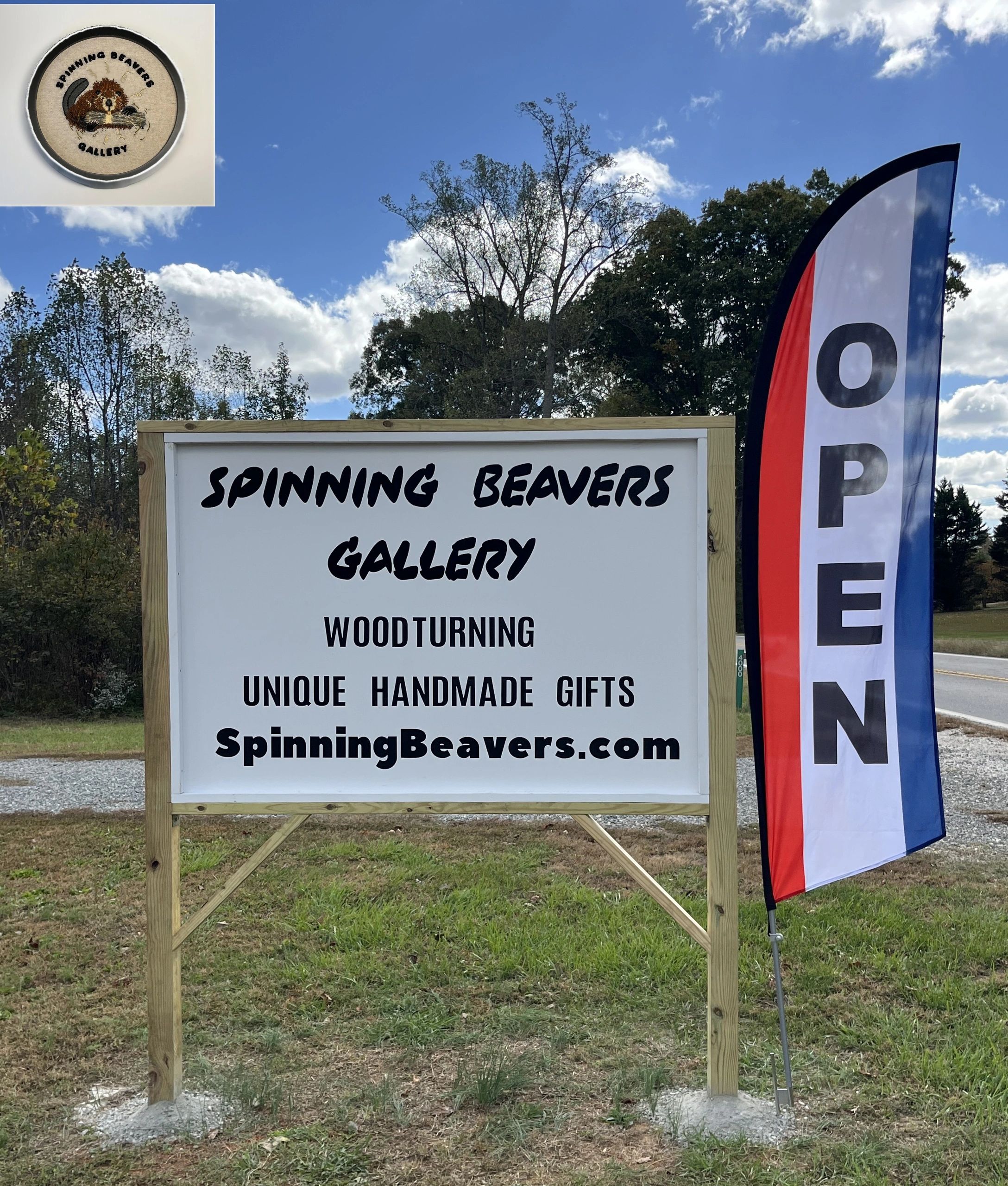 Spinning Beavers Gallery outdoor sign with blue sky.