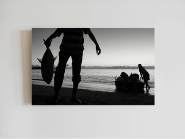 Fisherman in Mauritius. Black and white. Canvas printing. Trevally catch.