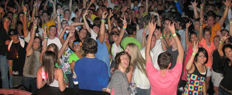 Large group of young people having fun at a party.
