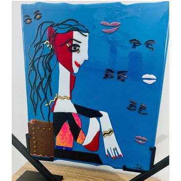Abstract painting of a seated woman with floating facial features on blue background.
