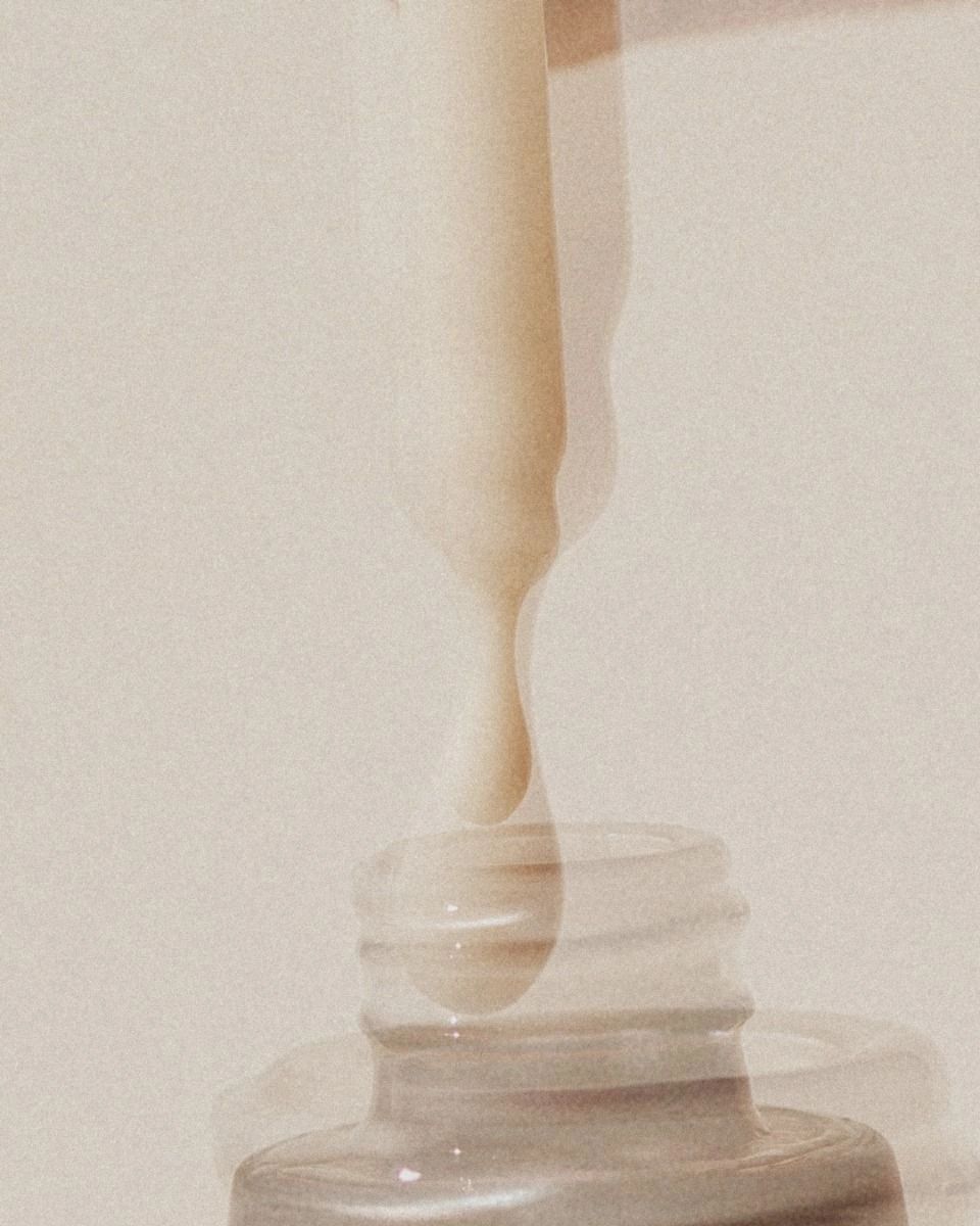 A drop of liquid falling into a bottle.