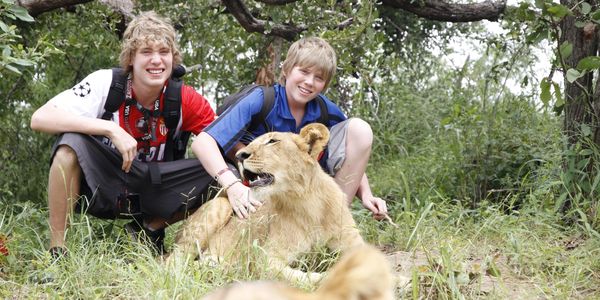 Sam and Theo at a lion preservation centre in Zimbabwe