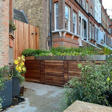 Stainless steel planter over bikebox, bespoke cladding 