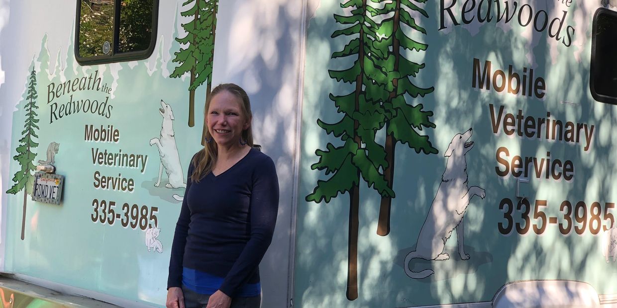 Dr. Jennifer Keil in front of mobile veterinary clinic