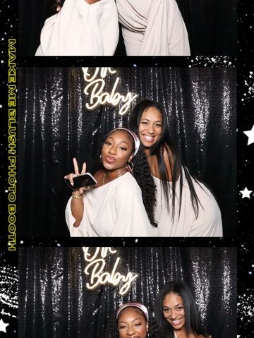 group of people smiling and enjoying photo booth 