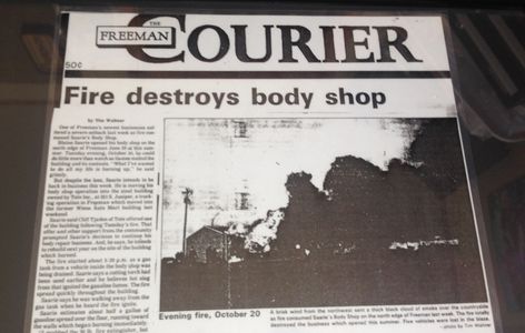 Newspaper snippet about a body shop fire.