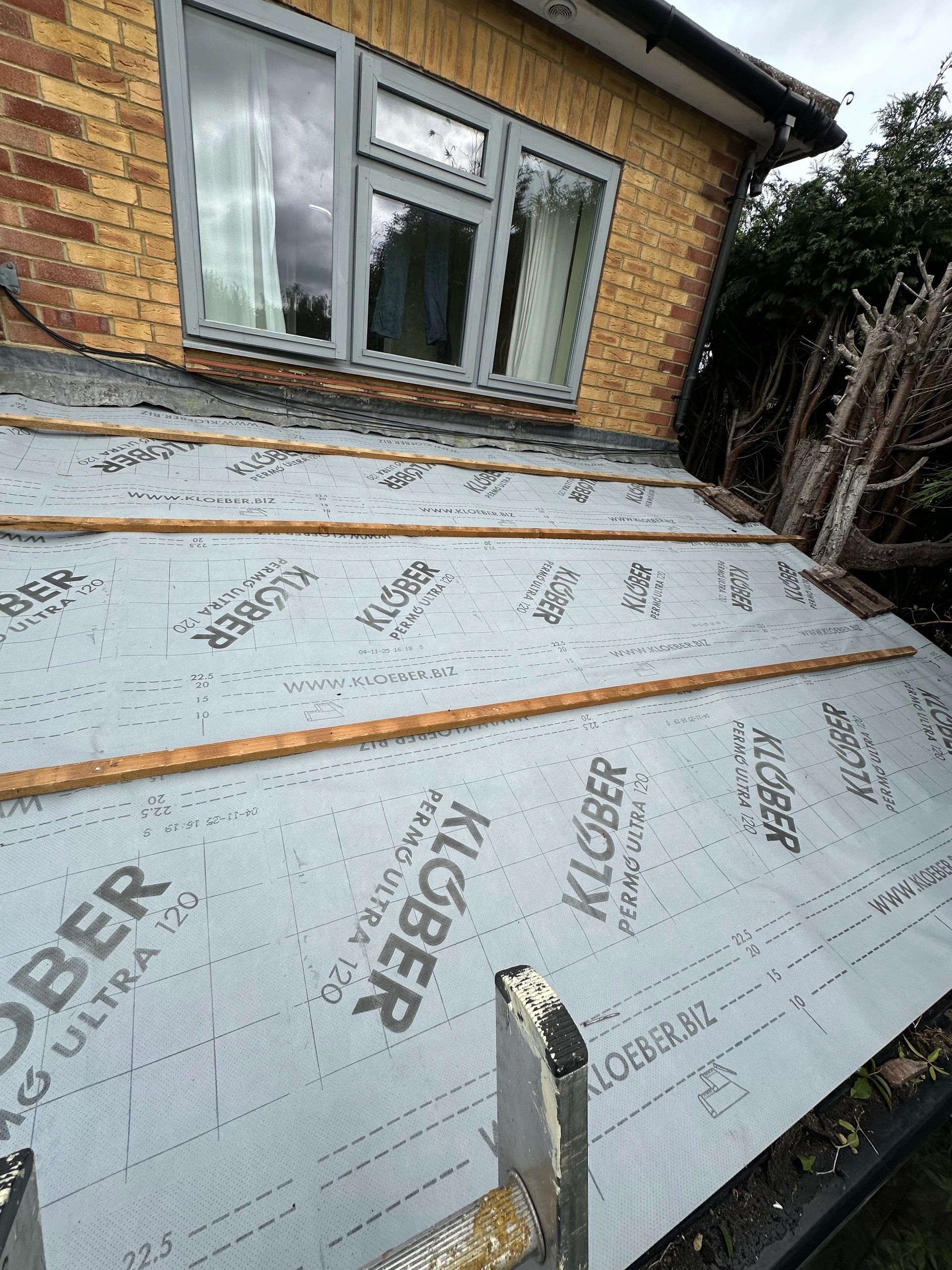 New roofing membrane and battens installed, providing a strong and weatherproof base for the new roof covering.