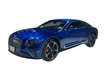 A sleek blue luxury sports car with black rims and red brake calipers.