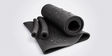 Black rubber mat and tubes with water droplets.