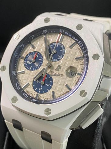 Close-up of a white Audemars Piguet chronograph watch with blue subdials.
