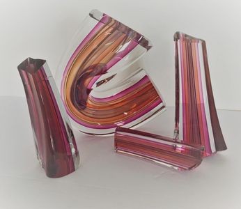 Distinctive striped glass sculptures in various shapes and colors.
