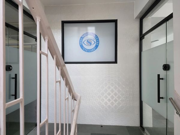 Staircase leading to a modern medical center entrance.
