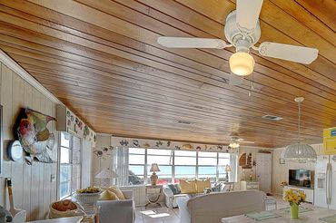 Kitchen with counter seating, open to the living room and beachfront patio