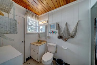 Full bathroom in the main house with a compact shower