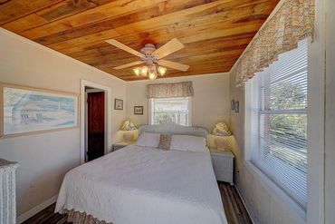 Detached guest cottage bedroom with a king-size bed and ensuite full bath