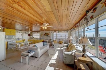 Family room seating area looking out to the patio and the Gulf of Mexico
