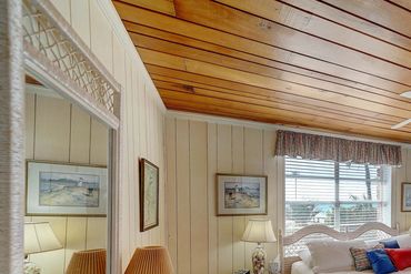 Master beach bedroom with a king-size bed at Lotts of Sun cottage