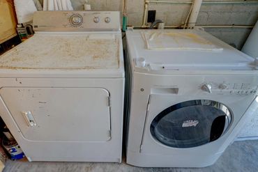 Laundry room with full-size washer and dryer in the guest cottage