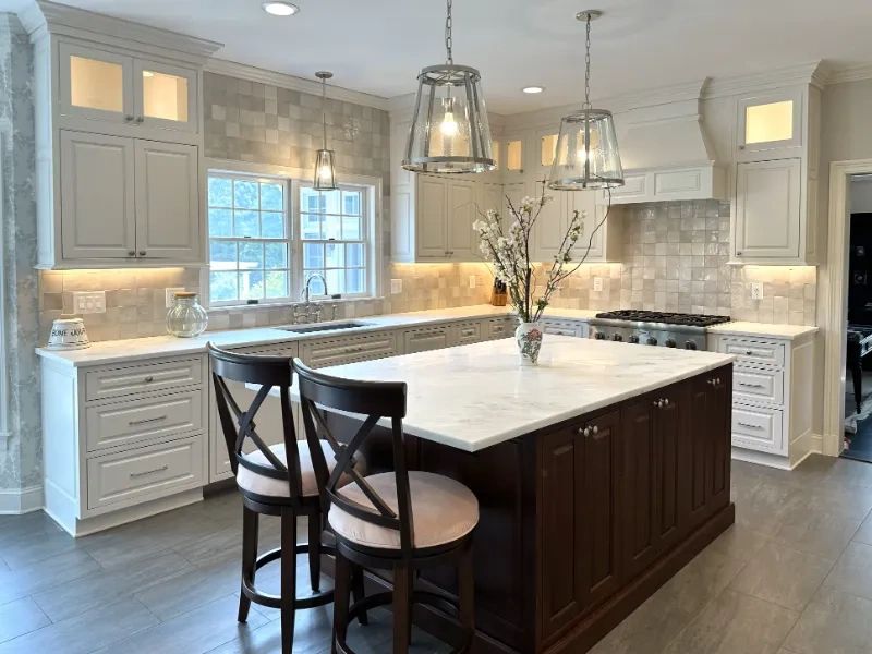 Westchester kitchen remodel with white cabinets, quartz tops & dark island – Kitchens by Frankie