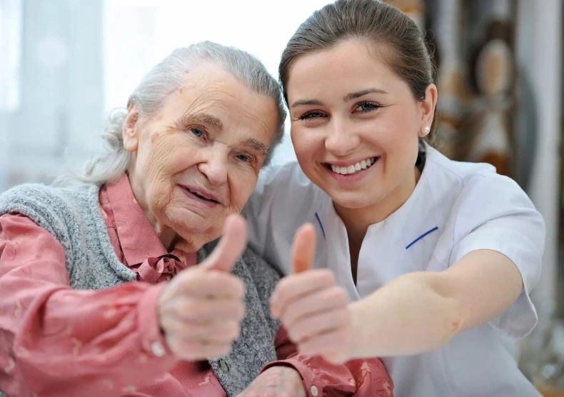 2 people showing thumbsup