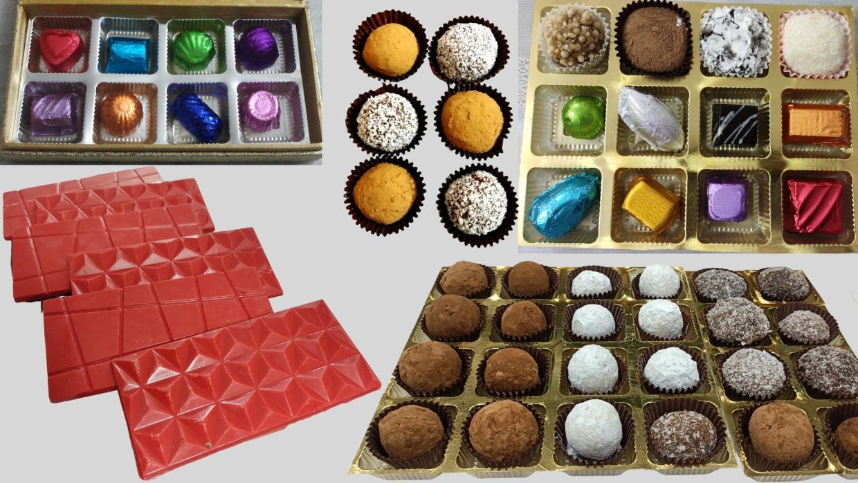Variety of chocolates and truffles in different packaging.