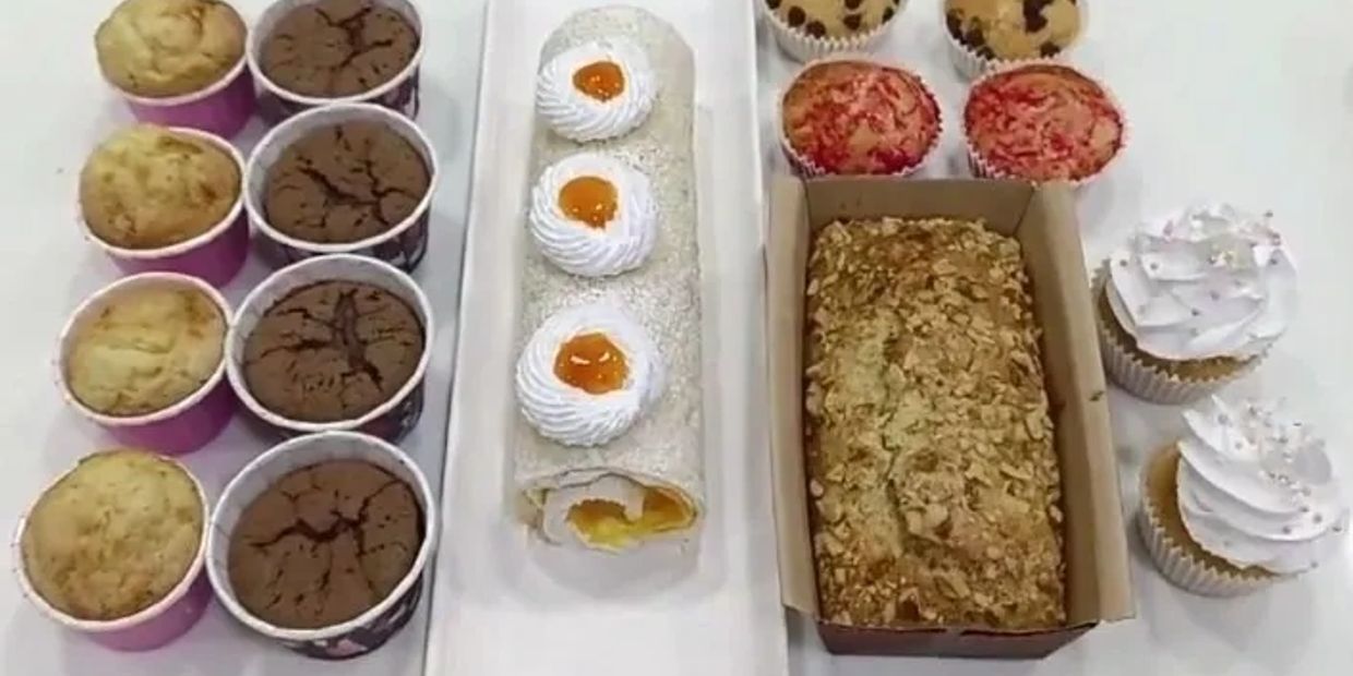 Assorted cupcakes, cake roll, and loaf bread.