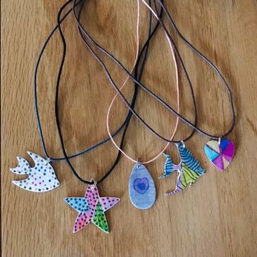 Colored Pencils on Metal Necklaces for class sign up 