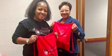 two women with red bags in their hand
