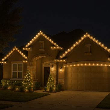 House decorated with warm white string lights at night.