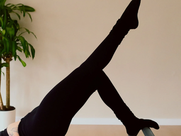 Client on reformer at Studio Aligned, best reformer Pilates studio in Sullivan County, NY.