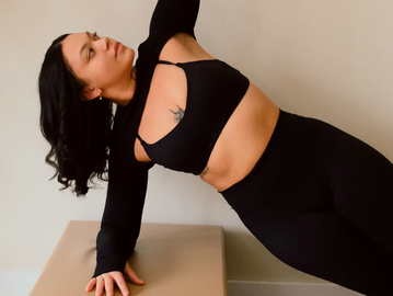 Client participating in contemporary reformer Pilates in Monticello, NY