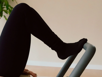 Client on reformer at Studio Aligned, best reformer Pilates studio in Sullivan County, NY.