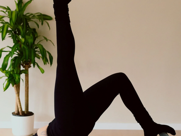 Client on reformer at Studio Aligned, best reformer Pilates studio in Sullivan County, NY.