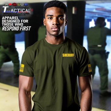 Man wearing sheriff tactical apparel in shooting range.