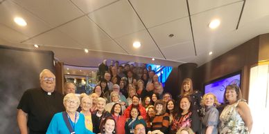 Large group of smiling people indoors.